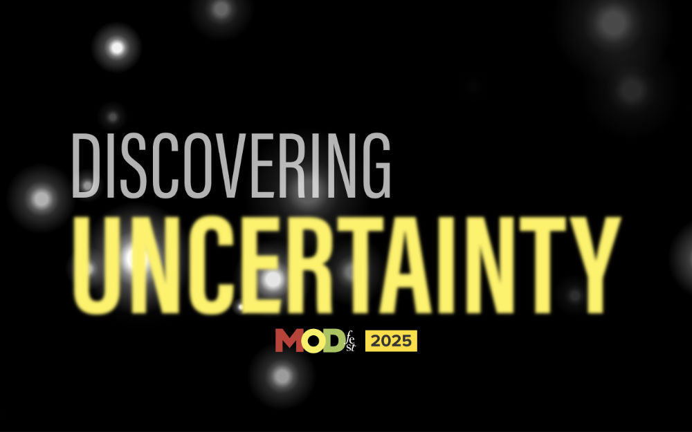 A screenshot of the Modfest 2025 site homepage, showing a dark background with the colored text 